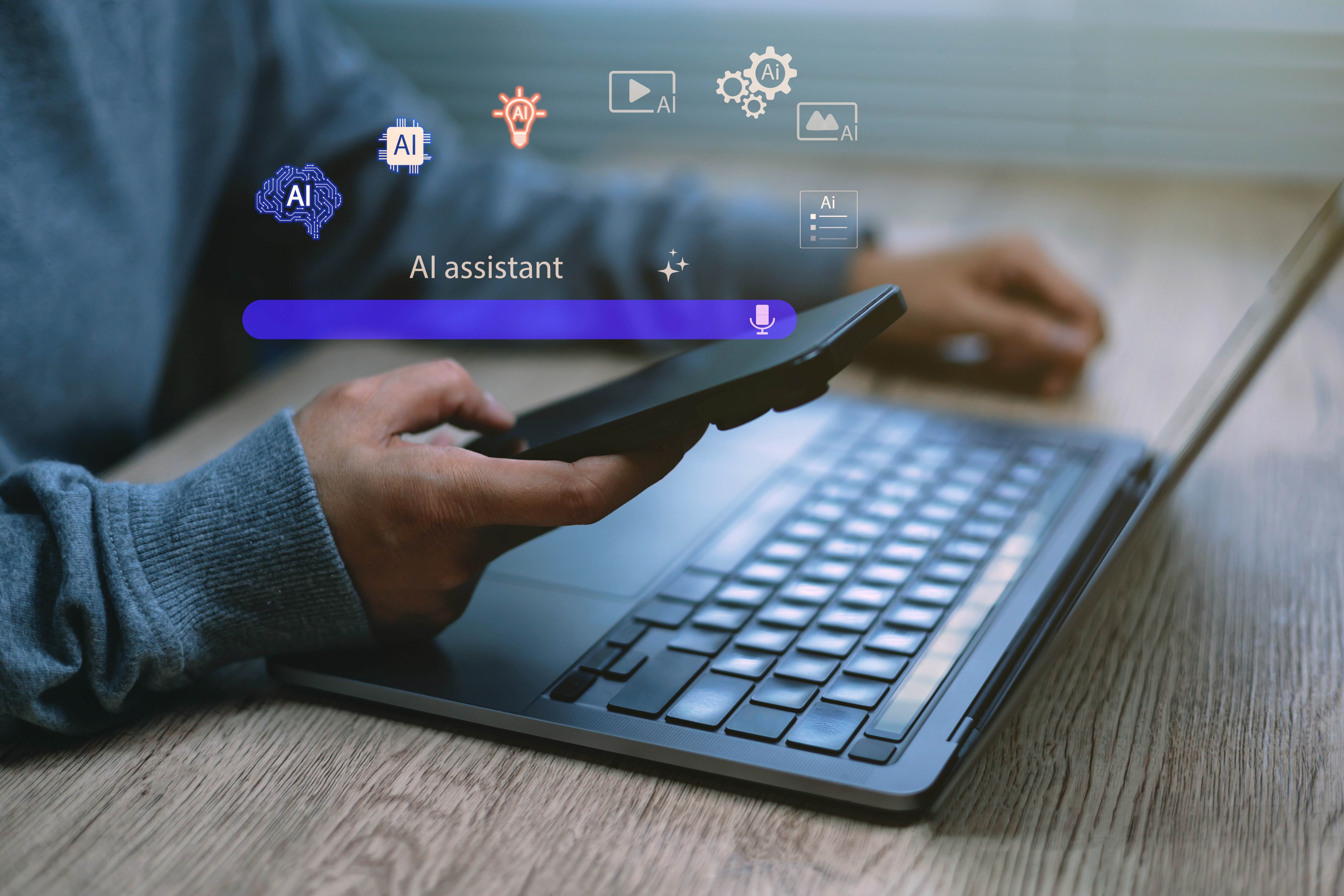 Person using AI on laptop and phone, implying use of AI to write continuous assessment